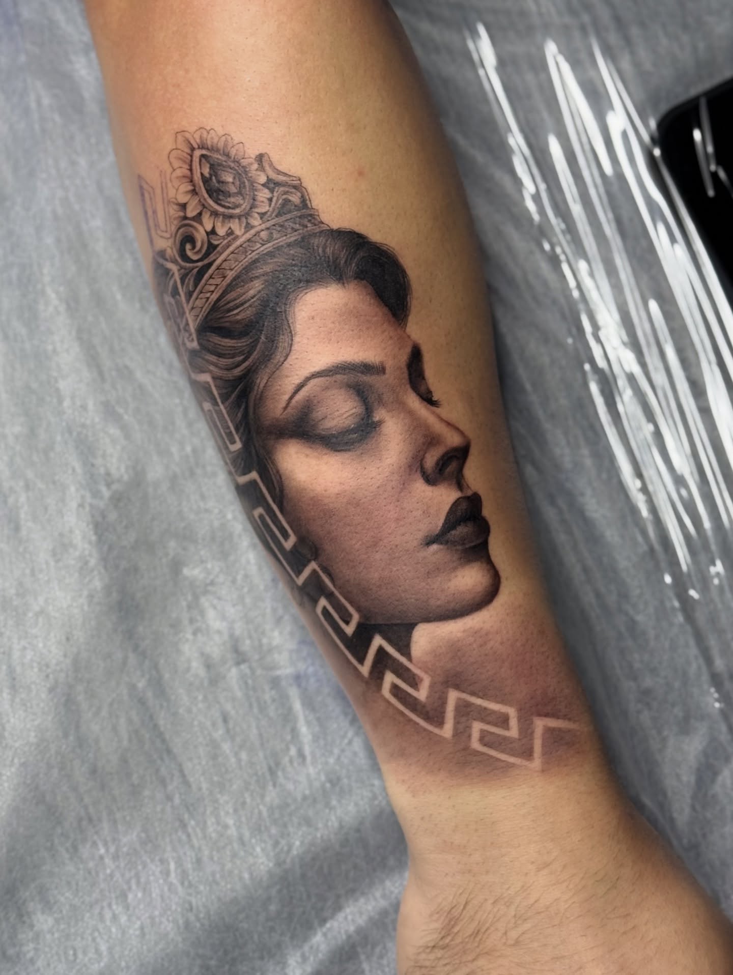 Woman's profile realism tattoo on the forearm by Iryna Polyakhova