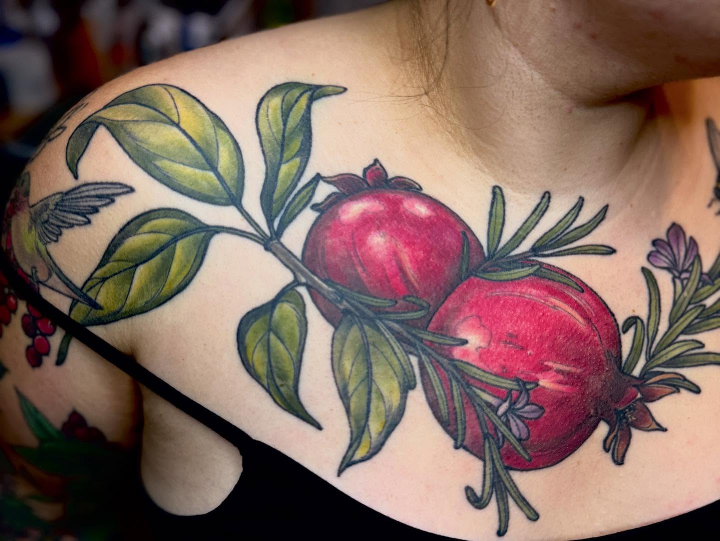 Pomegranates realism tattoo on the shoulder by Rachael Shelly