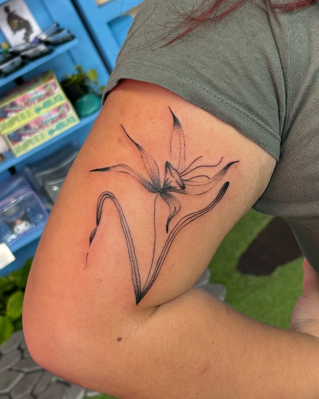 Flower fine line tattoo on the forearm by carla sofia