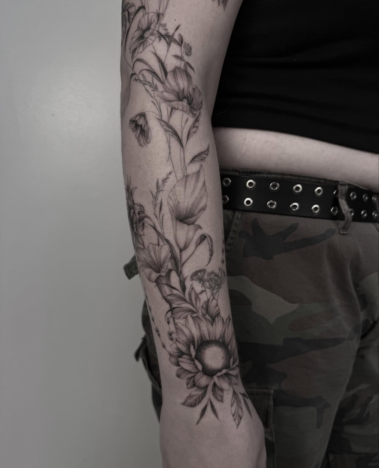 Floral arrangement realism tattoo on the forearm by ππππππ