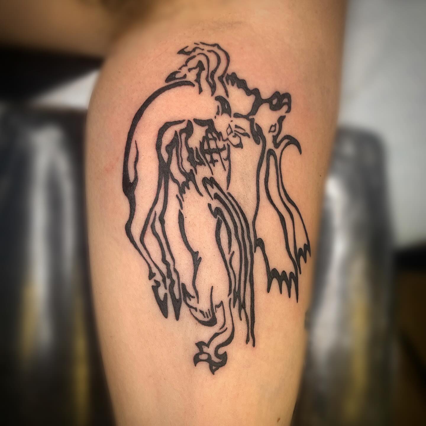 Demon black and grey tattoo on the thigh by Ava Glory Tattoos