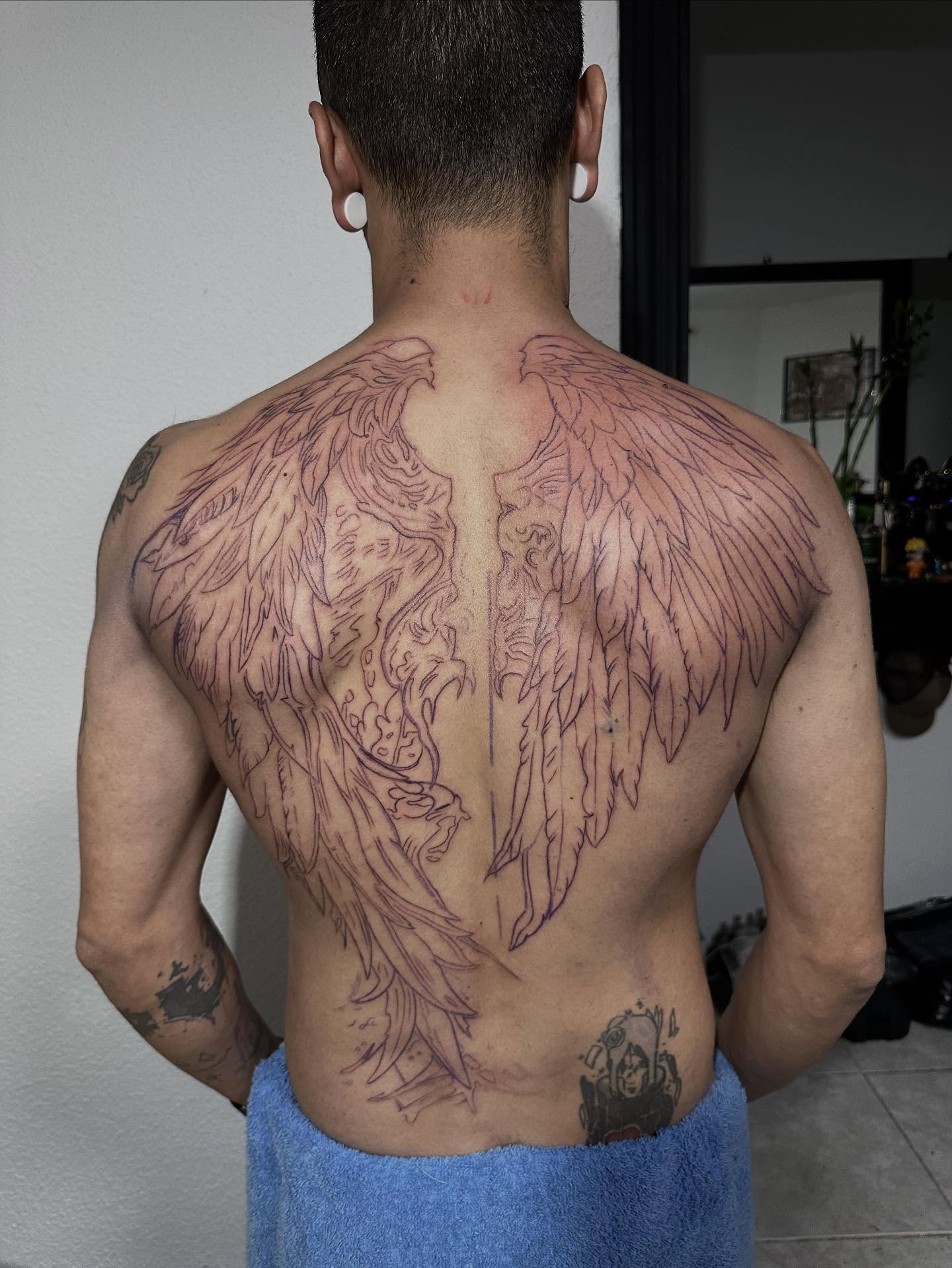 Wings black and grey tattoo on the back by Kunaytattoo