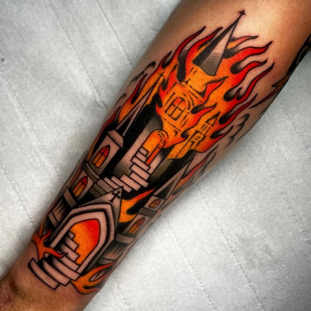 Burning church American traditional tattoo on the forearm by Hailey Johnson