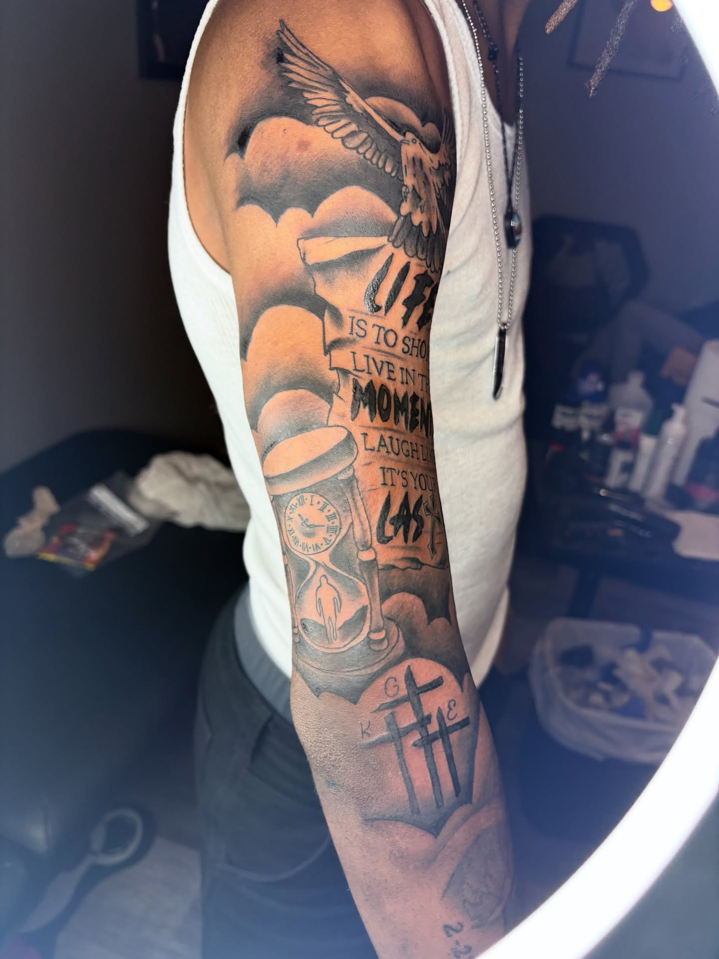 Hourglass and eagle black and grey tattoo on the forearm by Maleek Inkz