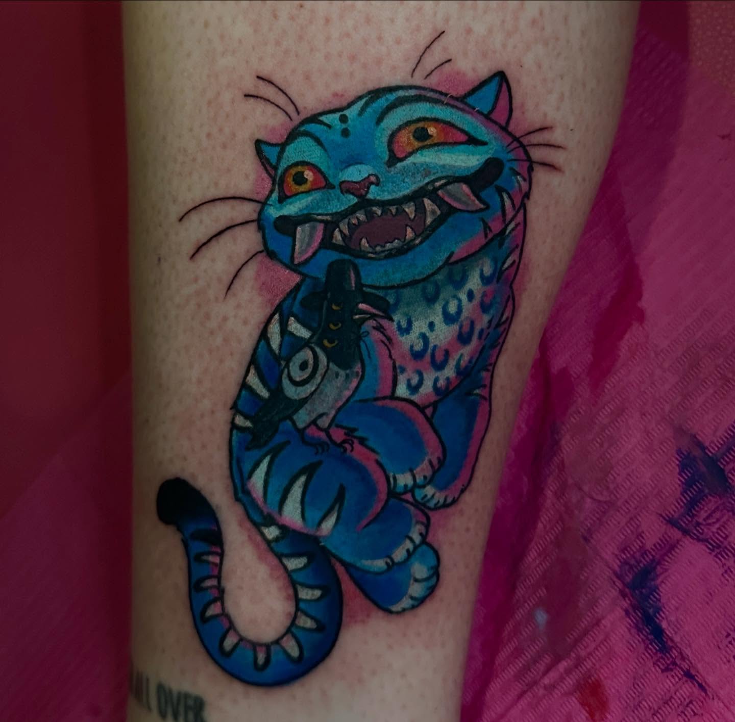 Blue cat new school tattoo on the forearm by Hannah Butterfield Tattoos, Ballston Lake, New York