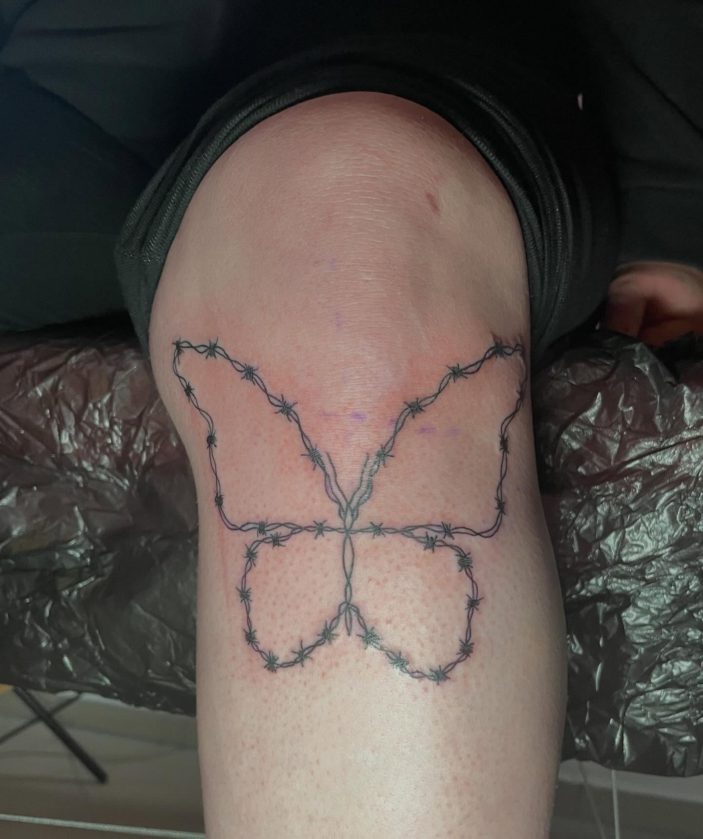 Barbed wire butterfly geometric tattoo on the thigh by lu ๐