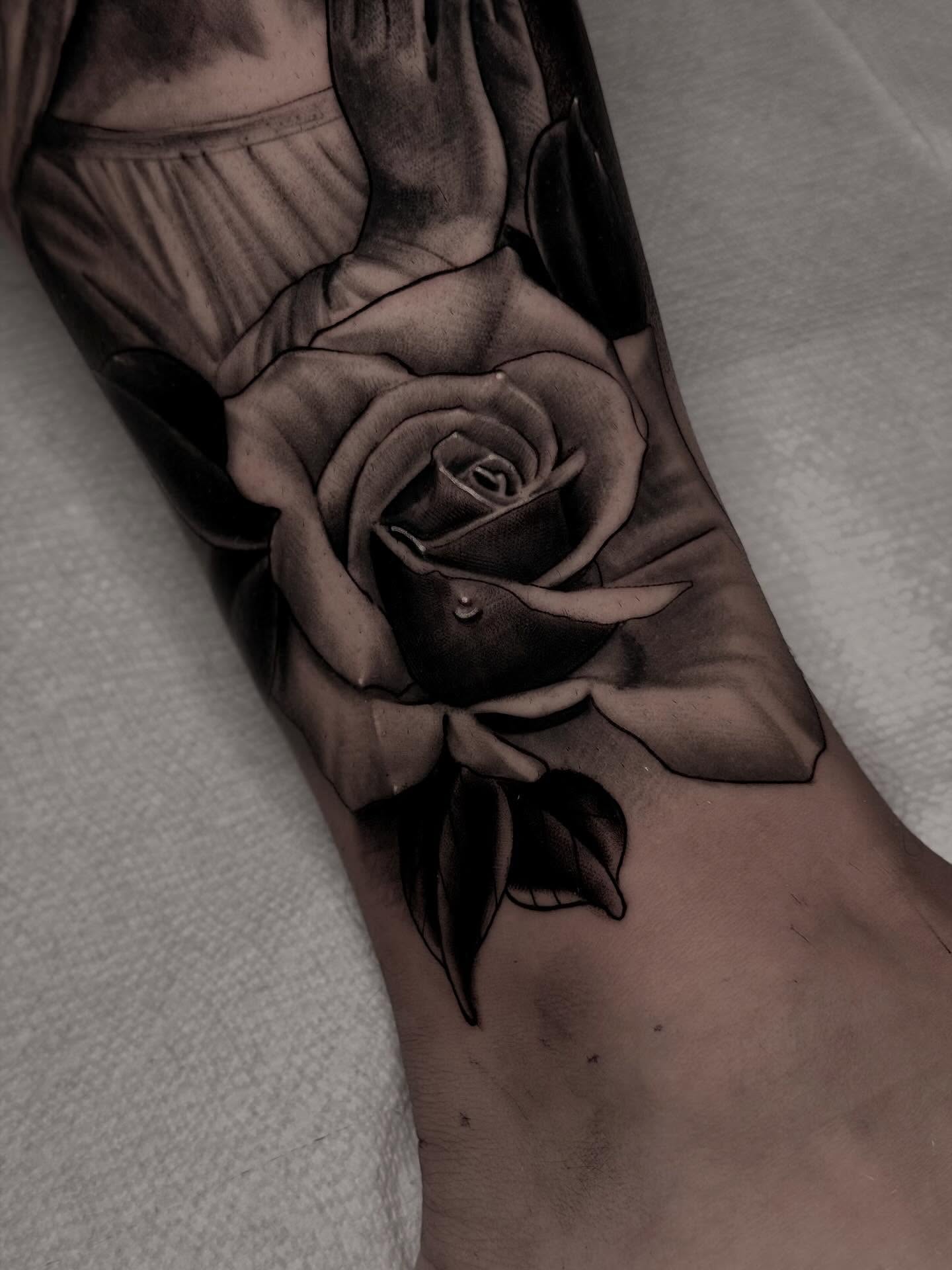 Rose realism tattoo on the forearm by Robert Graye