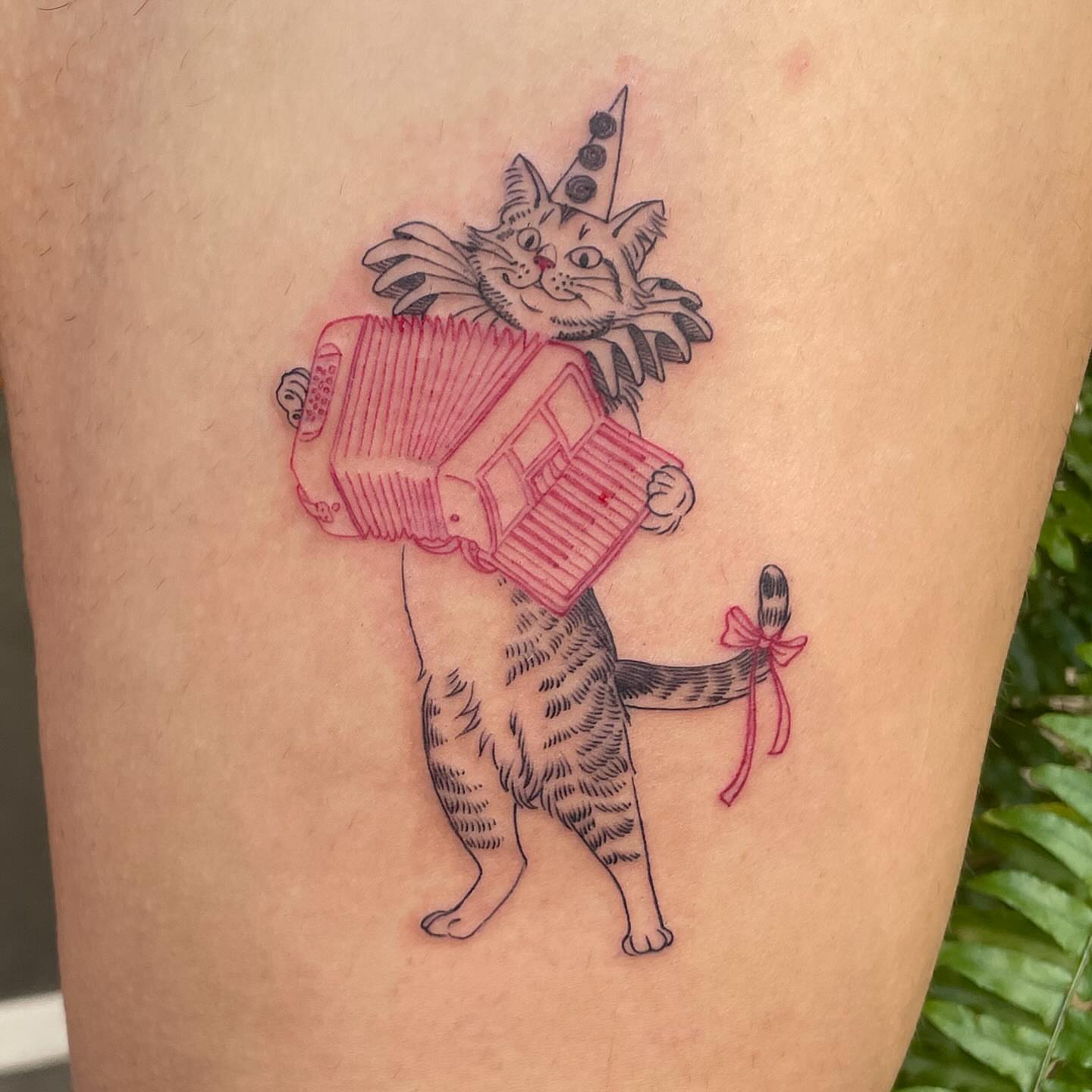 Cat playing accordion dotwork tattoo on the thigh by Ally Easter, Berkeley, California