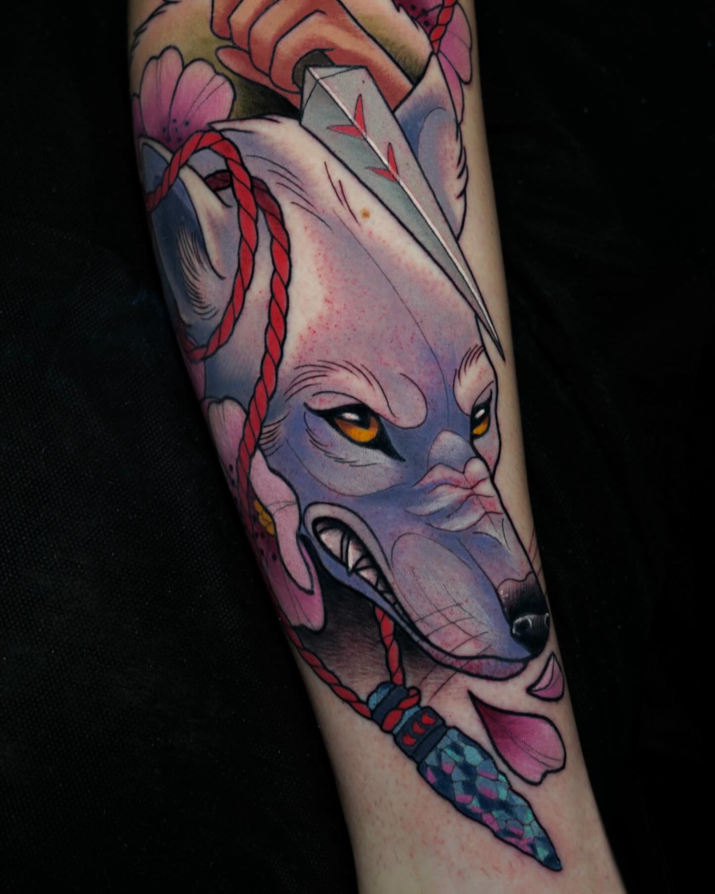 Wolf head American traditional tattoo on the forearm by Brooke Borden