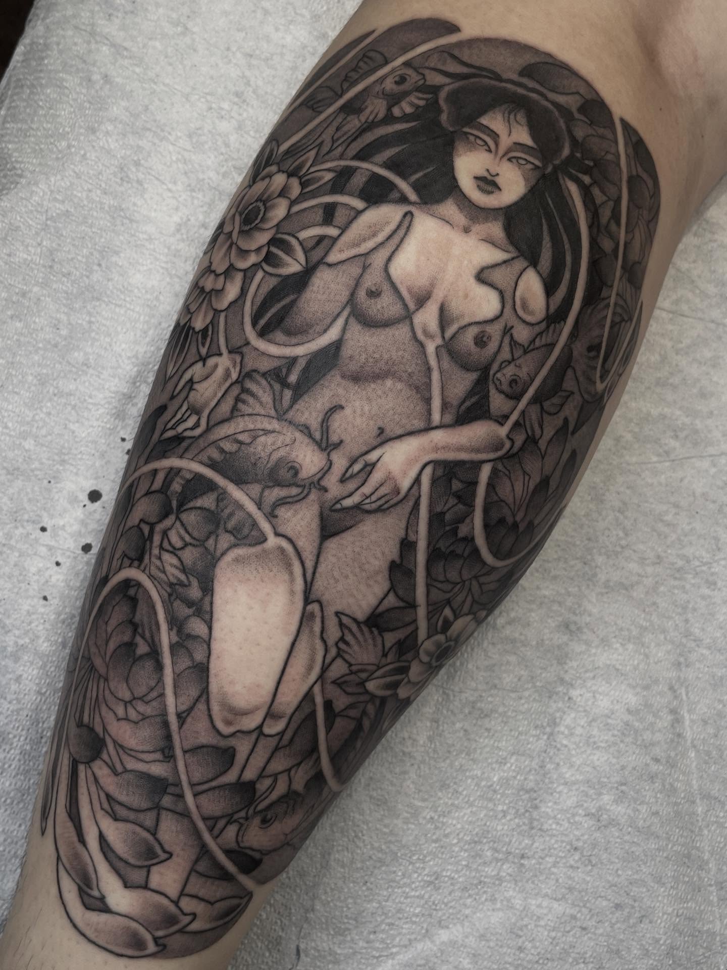Nude woman with fish realism tattoo on the forearm by Amanda Marie, Edmonds, Washington