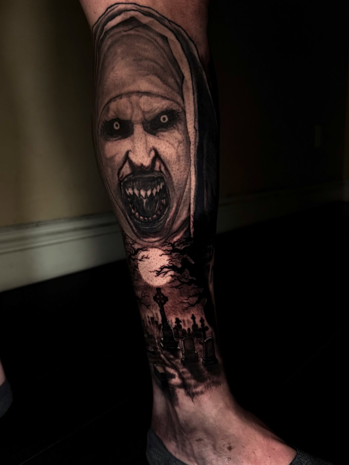 Horror mask dark realism tattoo on the forearm by Isaac