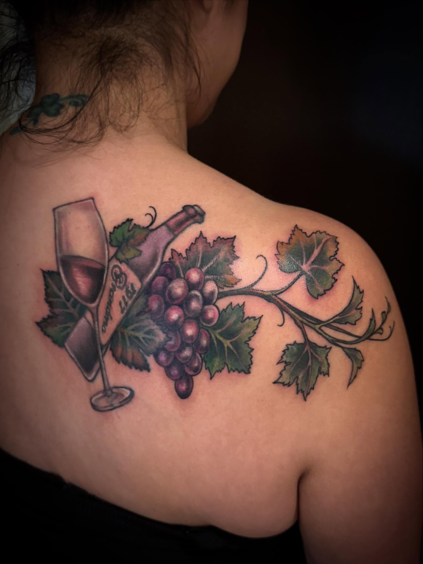 Grapes and wine realism tattoo on the shoulder by Brennan Walker, Orem, Utah