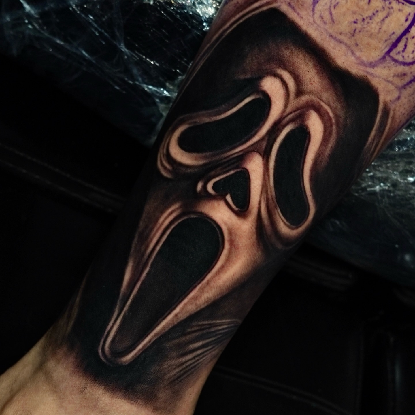 Mask dark realism tattoo on the forearm by Dallas tattoo artist