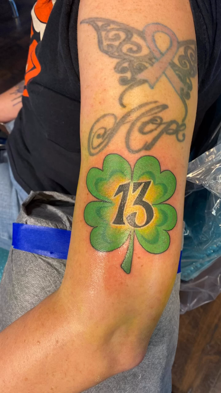 Shamrock with number 13 tattoo on the forearm by jim collins, Dayton, Ohio