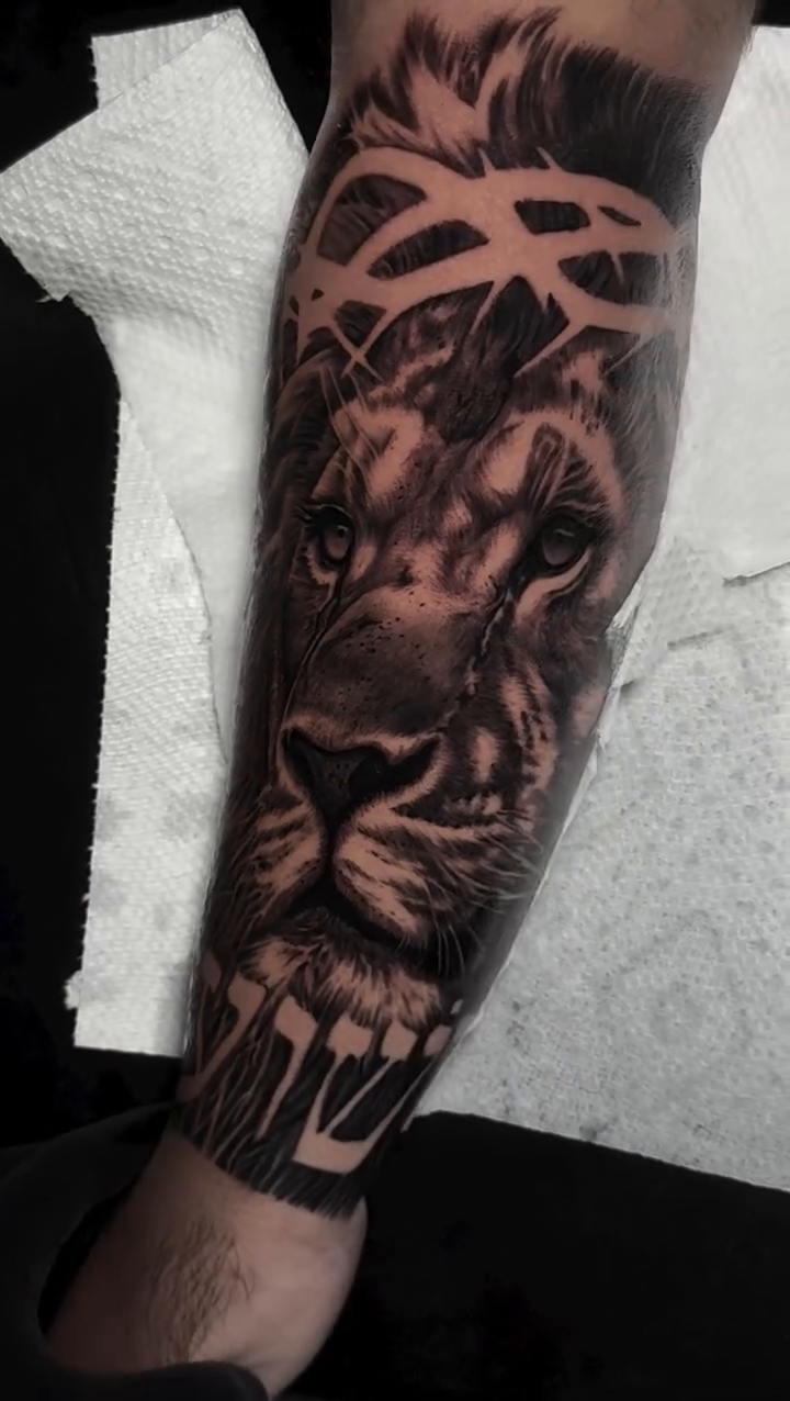 Lion with crown of thorns realism tattoo by Michael Sosa