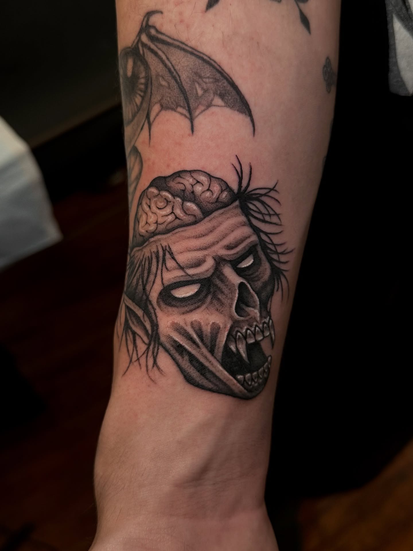 Zombie skull dark realism tattoo on the forearm by Marisa Biddle