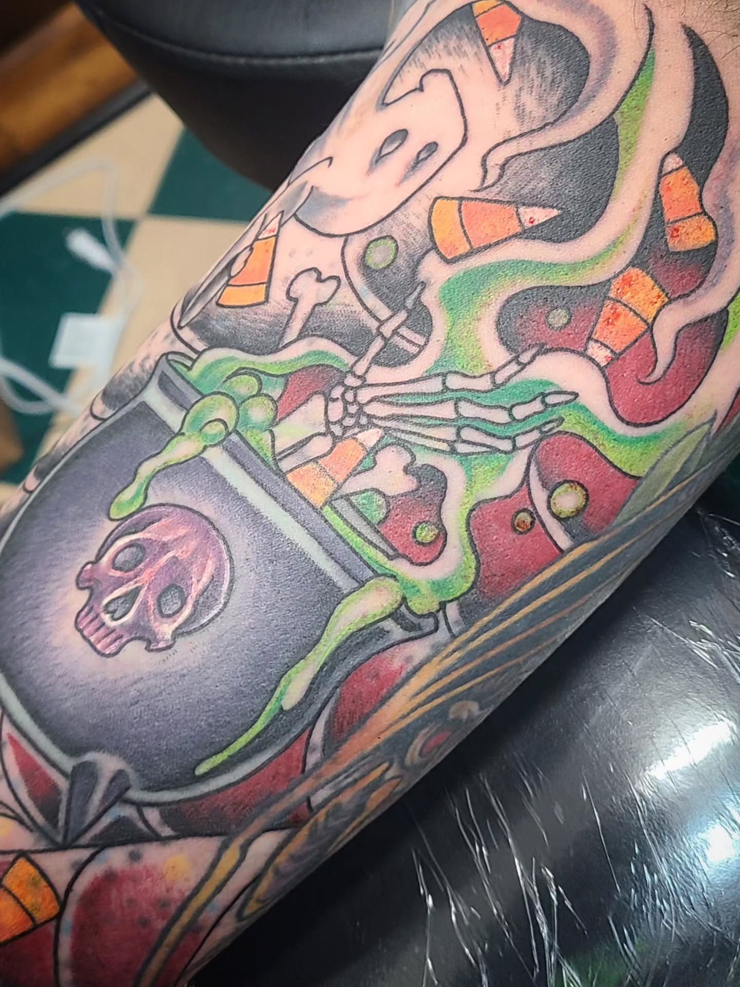 Candy corn skeleton American traditional tattoo on the forearm by David Vodicka