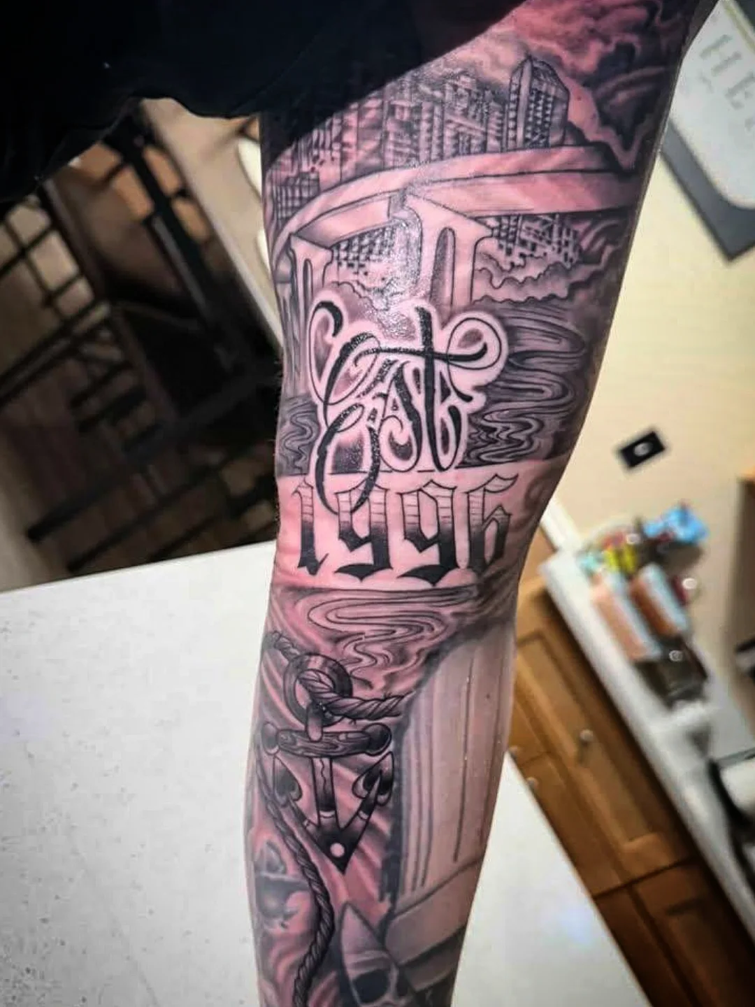 Cityscape geometric tattoo on the forearm by Josh Sroga