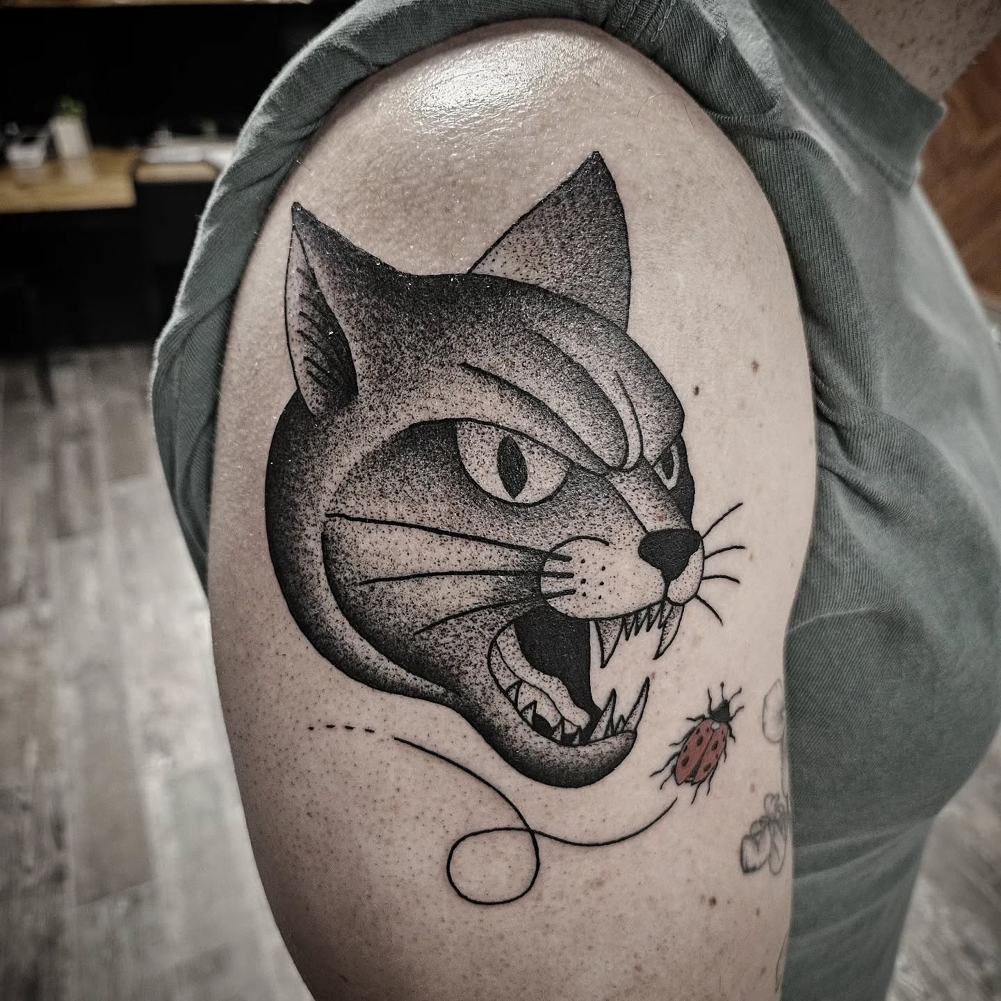 Cat dotwork tattoo on the shoulder by Kirk George
