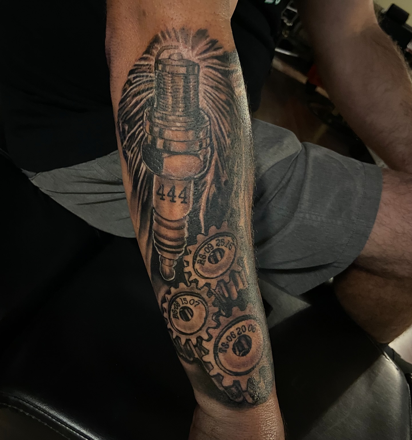 Spark plug and gears realism tattoo on the forearm by Colt