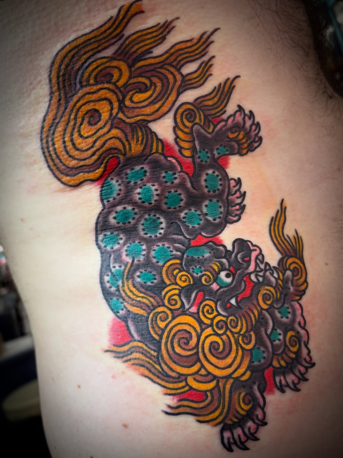 Lion American traditional tattoo on the shoulder by Carlos Gonzalez Tattoo, Dallas, Texas