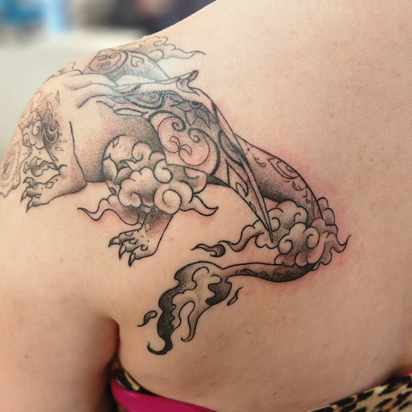 Dragon black and grey tattoo on the shoulder by Samantha Von Zombia, Saint Paul, Minnesota