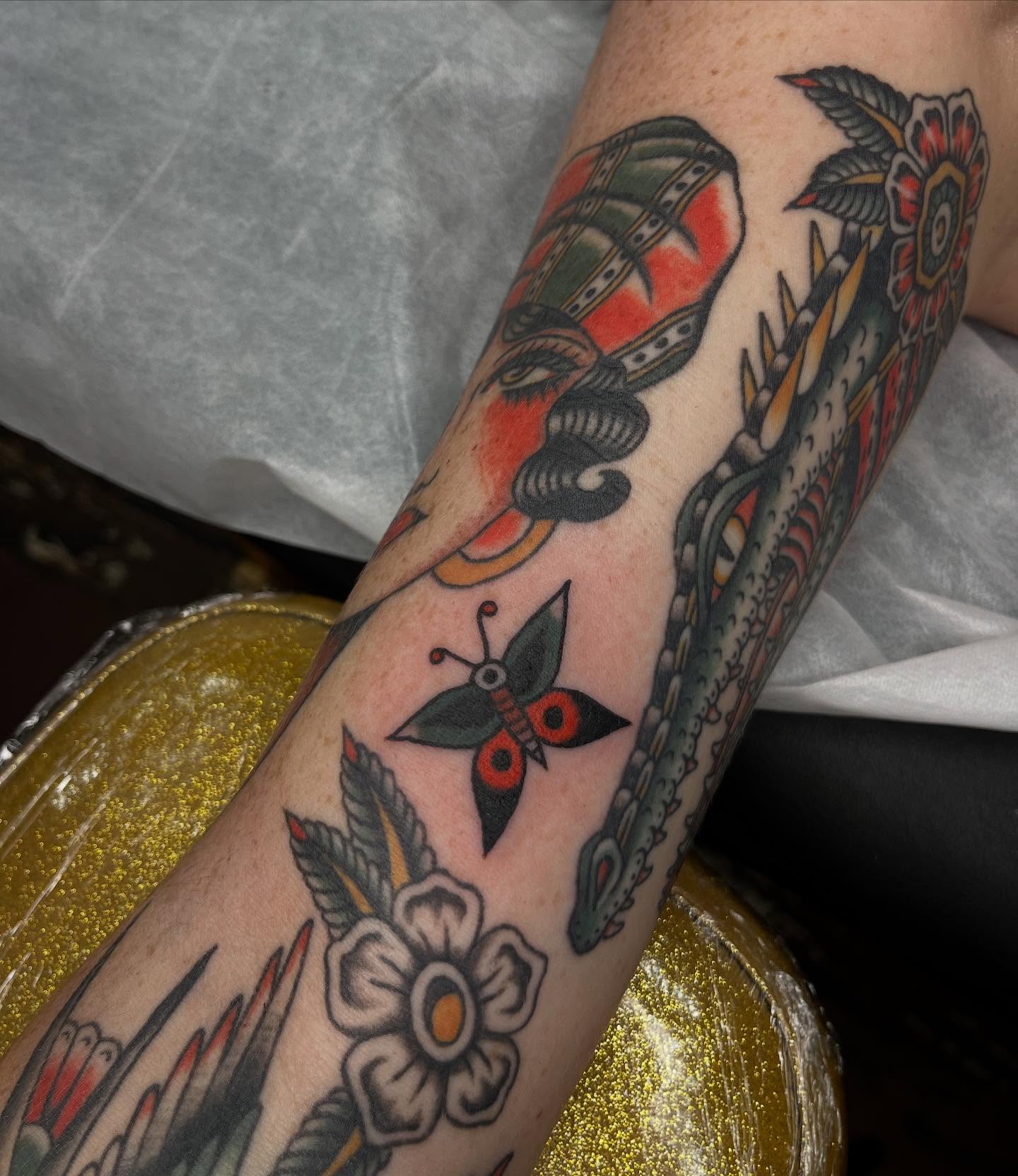 Mask and dragon American traditional tattoo on the forearm by Nicole💀, Salt Lake City, Utah
