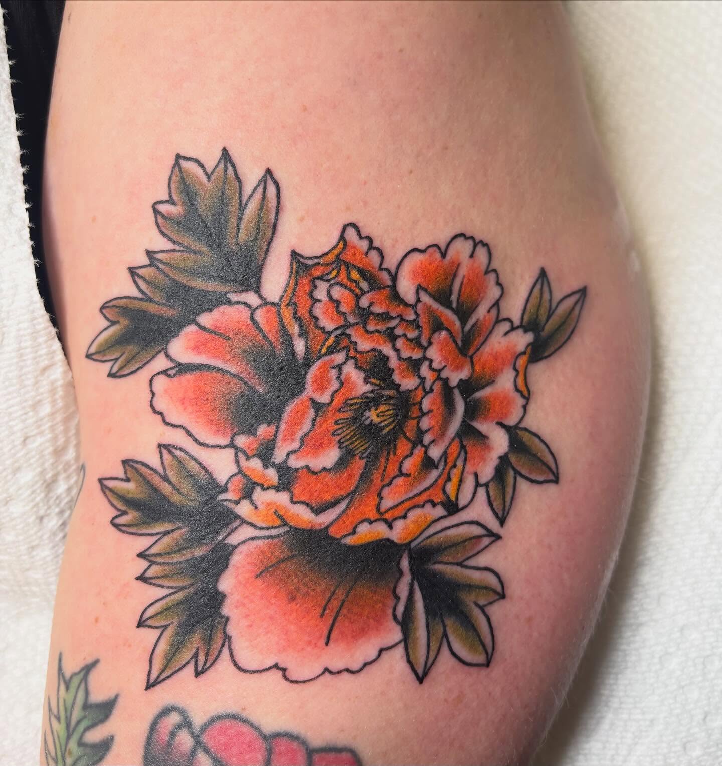 Peony American traditional tattoo on the forearm by Ben Whyte