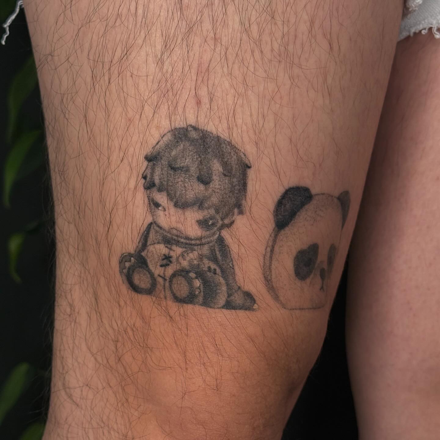 Teddy bear and panda black and grey tattoo on the forearm by šianca٠࣪ā