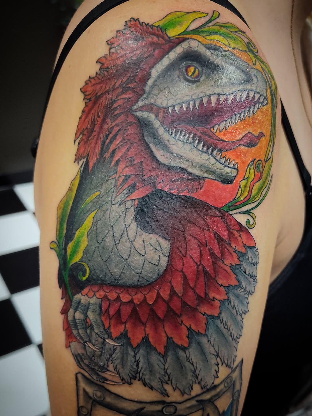 Dinosaur realism tattoo on the shoulder by Julie MacDonald