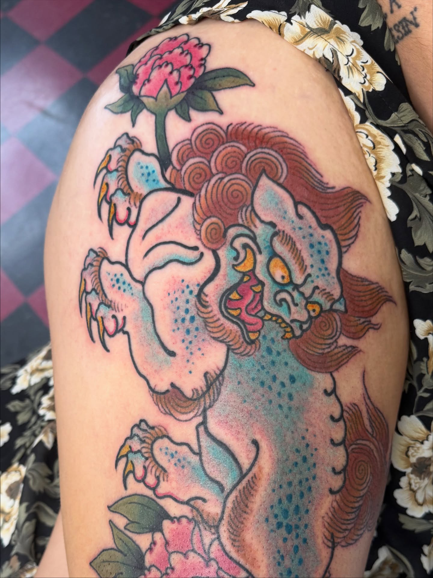 Lion and peony American traditional tattoo on the thigh by DemianThompson