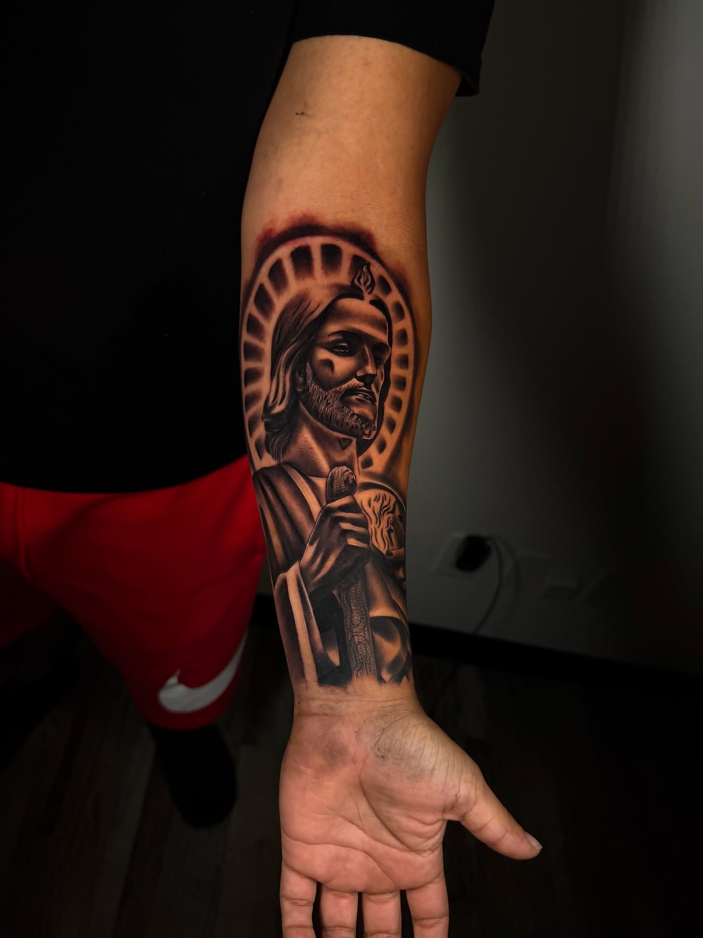 Religious figure black and grey tattoo on the forearm by Aaron Saenz jr
