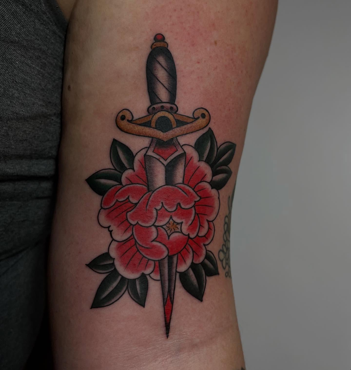 Sword and flower American traditional tattoo on the forearm by Kayla Faircloth, Charlotte, North Carolina