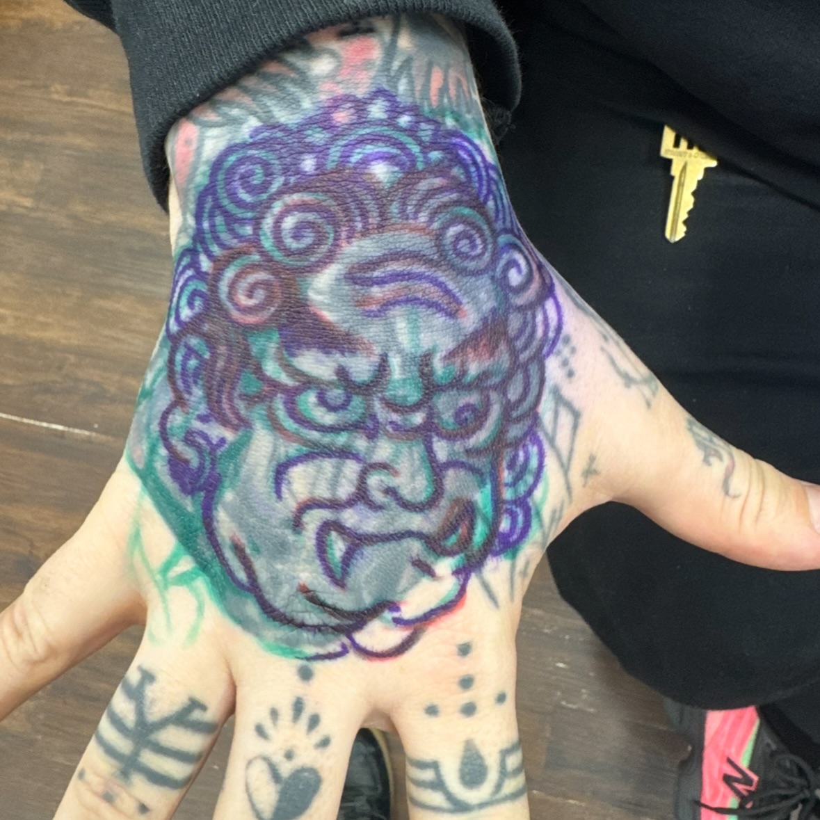Lion dotwork tattoo on the hand by Leif Hansen