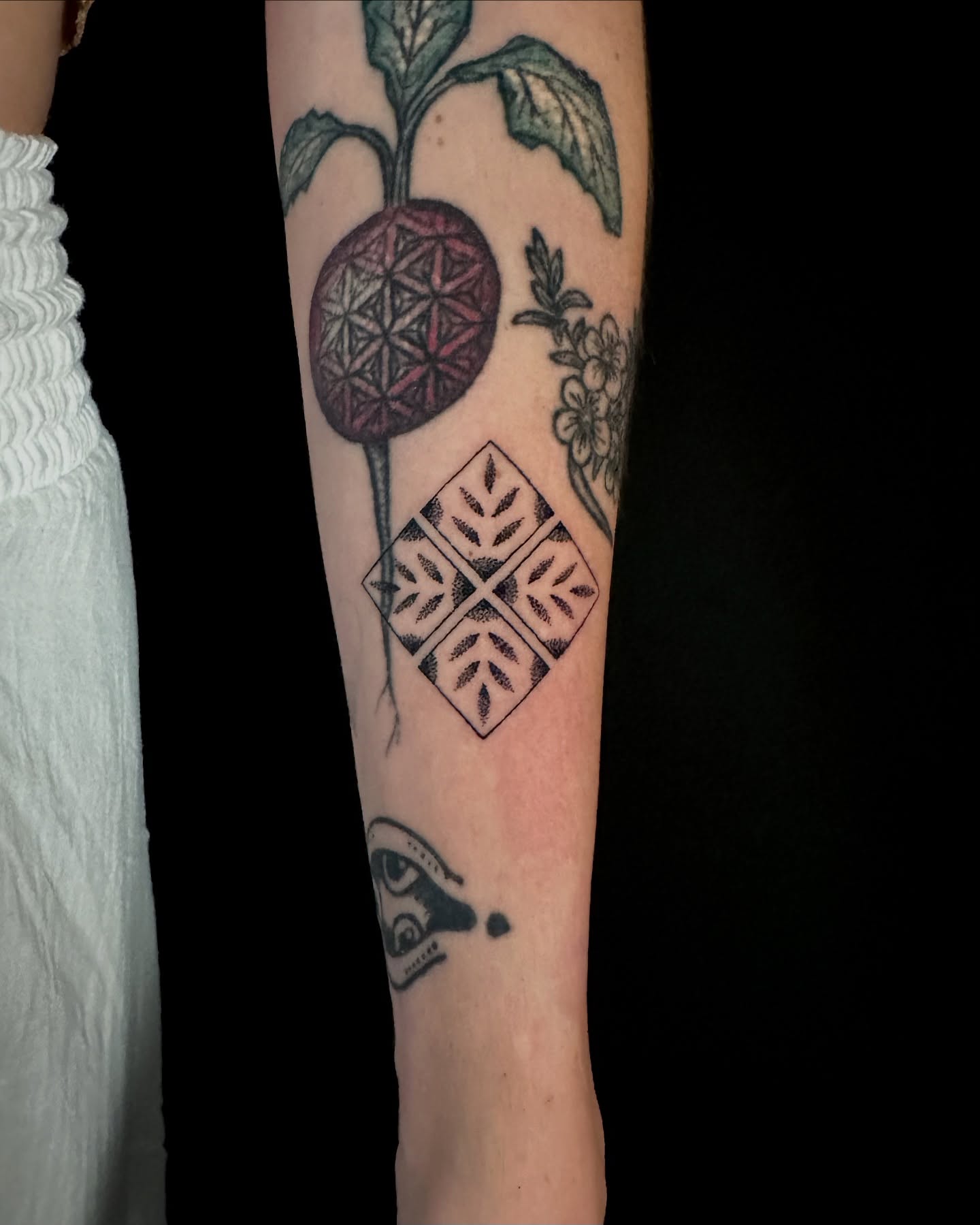 Geometric pattern dotwork tattoo on the forearm by Chelsey