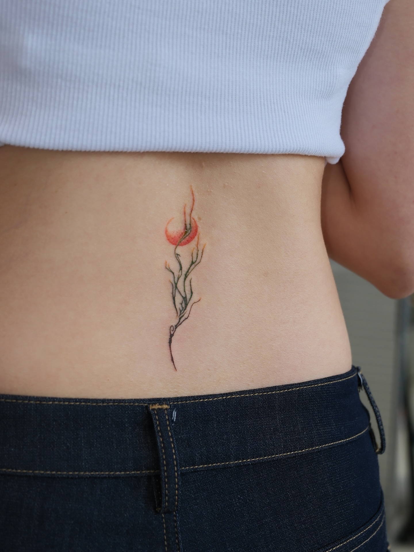 Flower bud dotwork tattoo on the ribs by Max