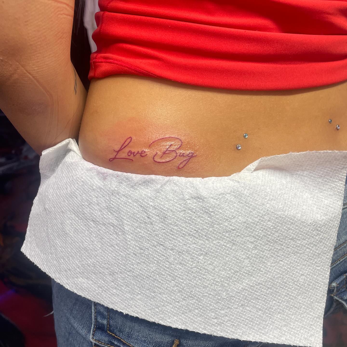 Love Bug lettering script tattoo on the torso by 😈headhuncho😈