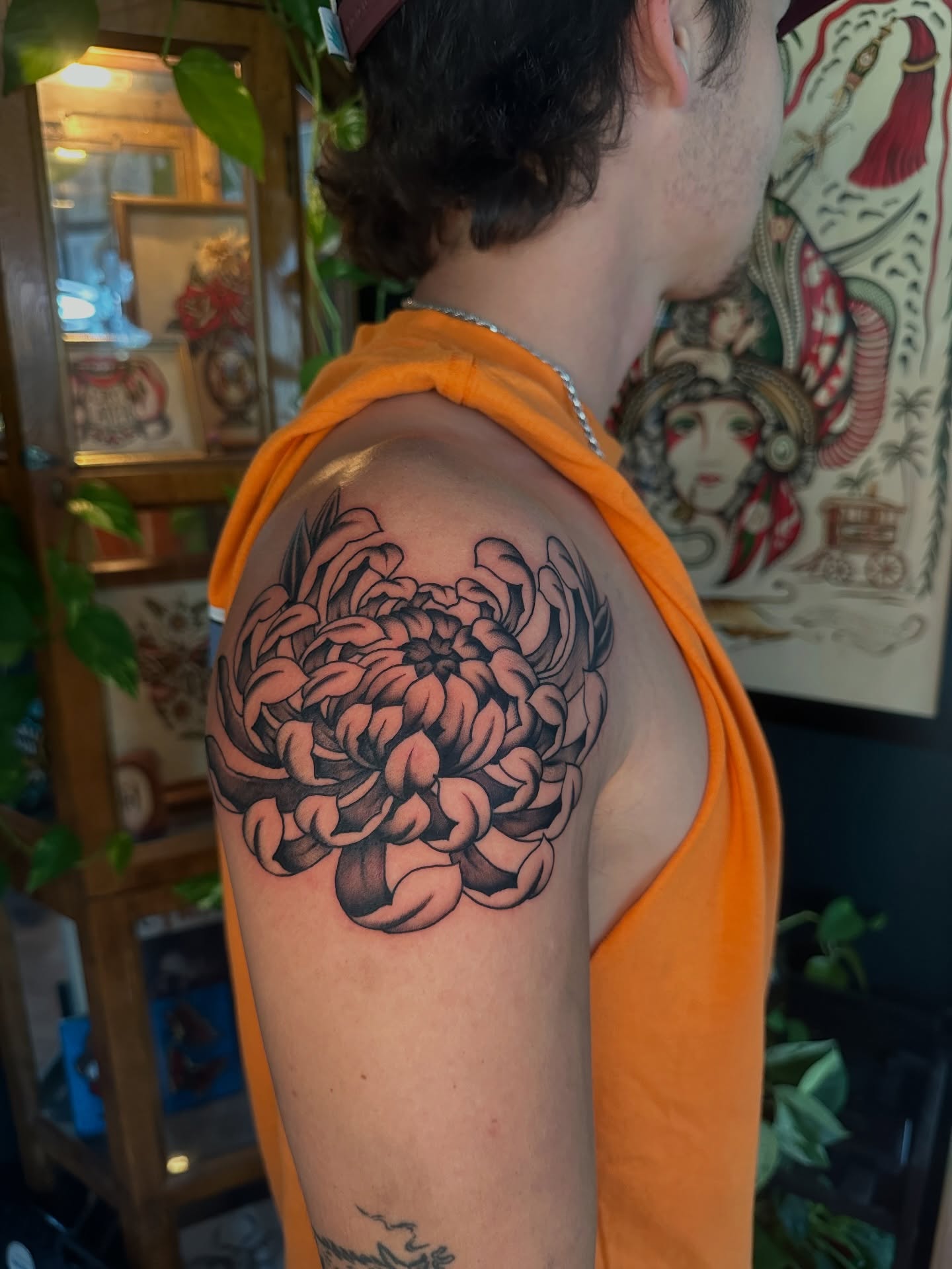 Chrysanthemum black and grey tattoo on the shoulder by Max Peterson