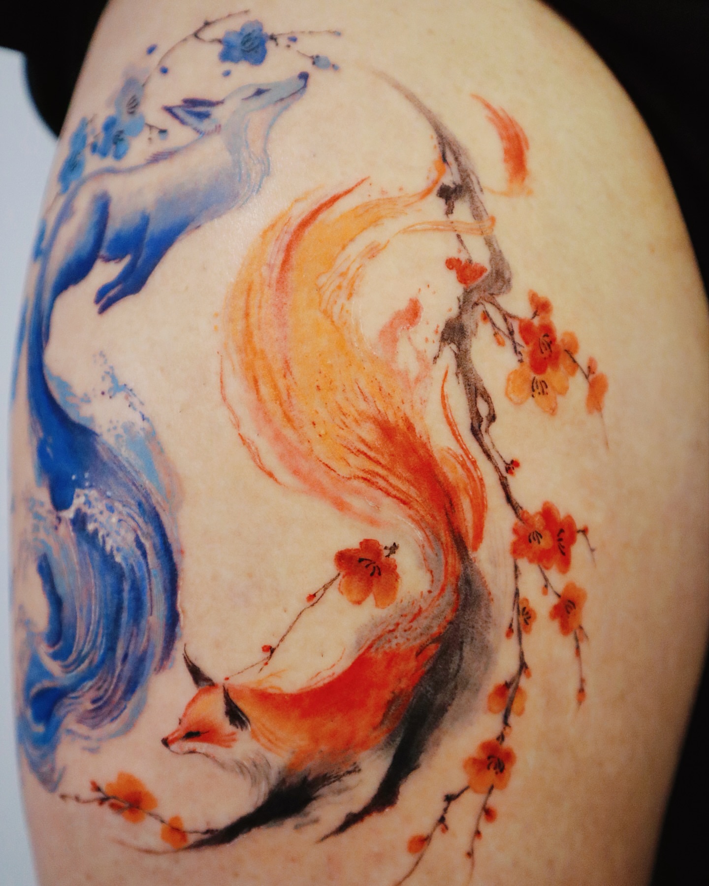 Fox and blossoms watercolor tattoo on the shoulder by Sylvia｜思岐, Vancouver, British Columbia