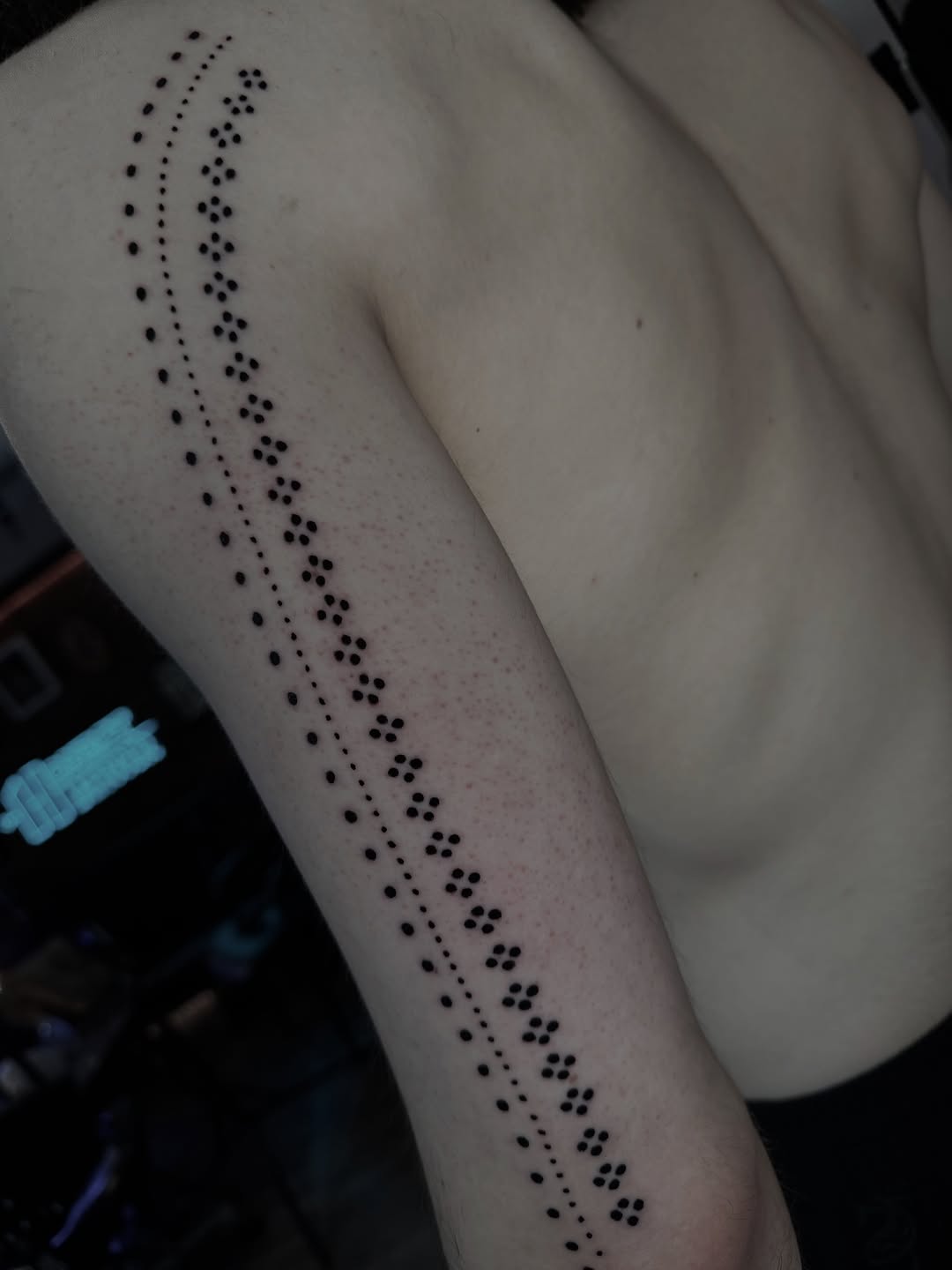 Pattern of dots dotwork tattoo on the forearm by Lisa Nikolopoulos, New York, New York