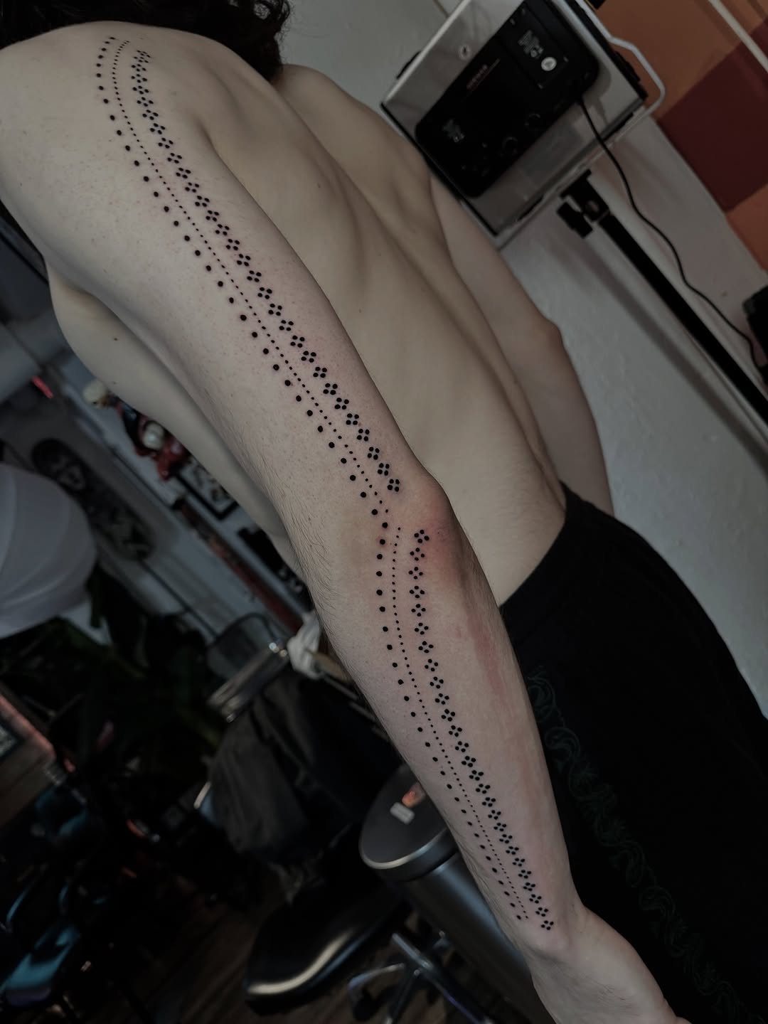 Patterned line dotwork tattoo on the forearm by Lisa Nikolopoulos, New York, New York