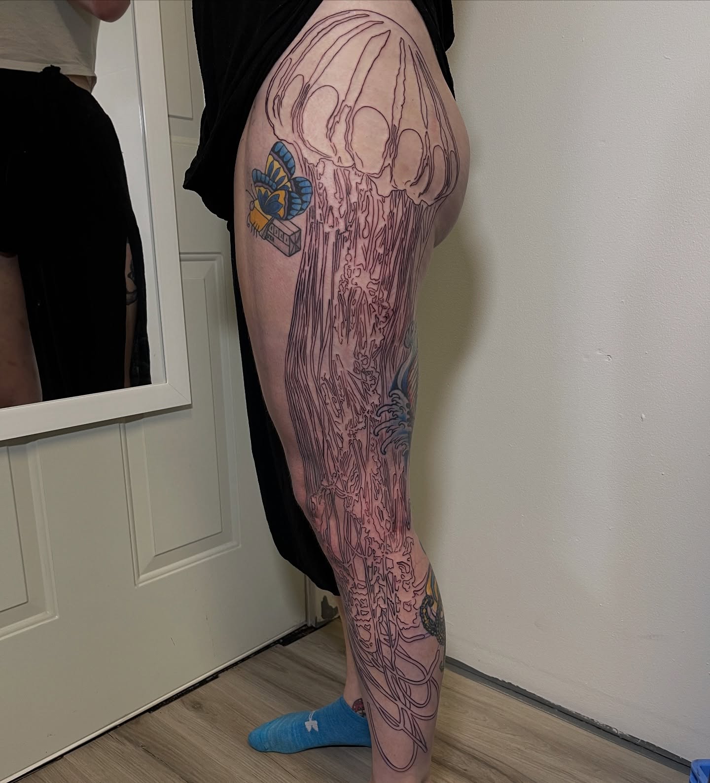 Jellyfish black and grey tattoo on the thigh by Ashley Antolin