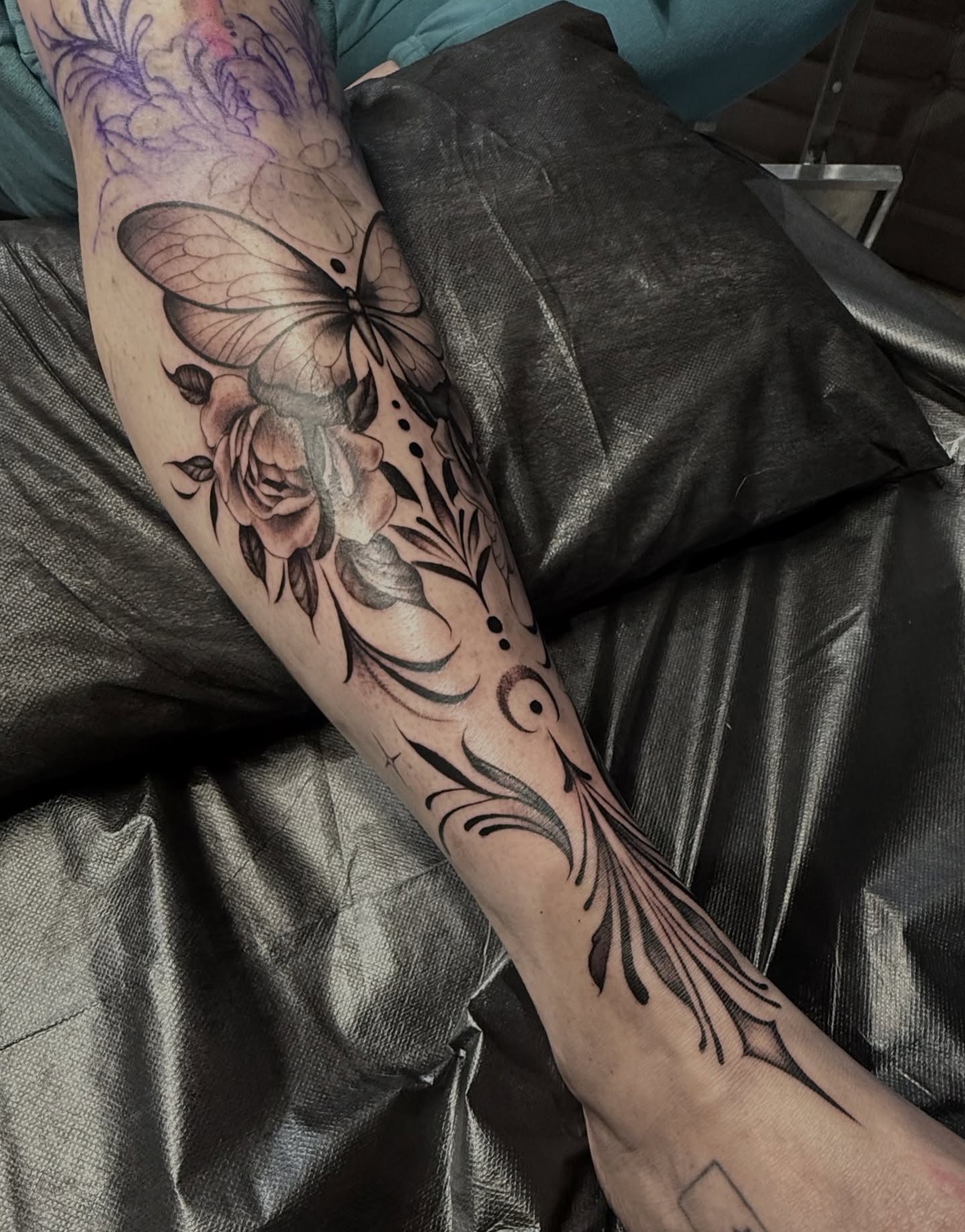 Butterfly and roses realism tattoo on the forearm by Grace P