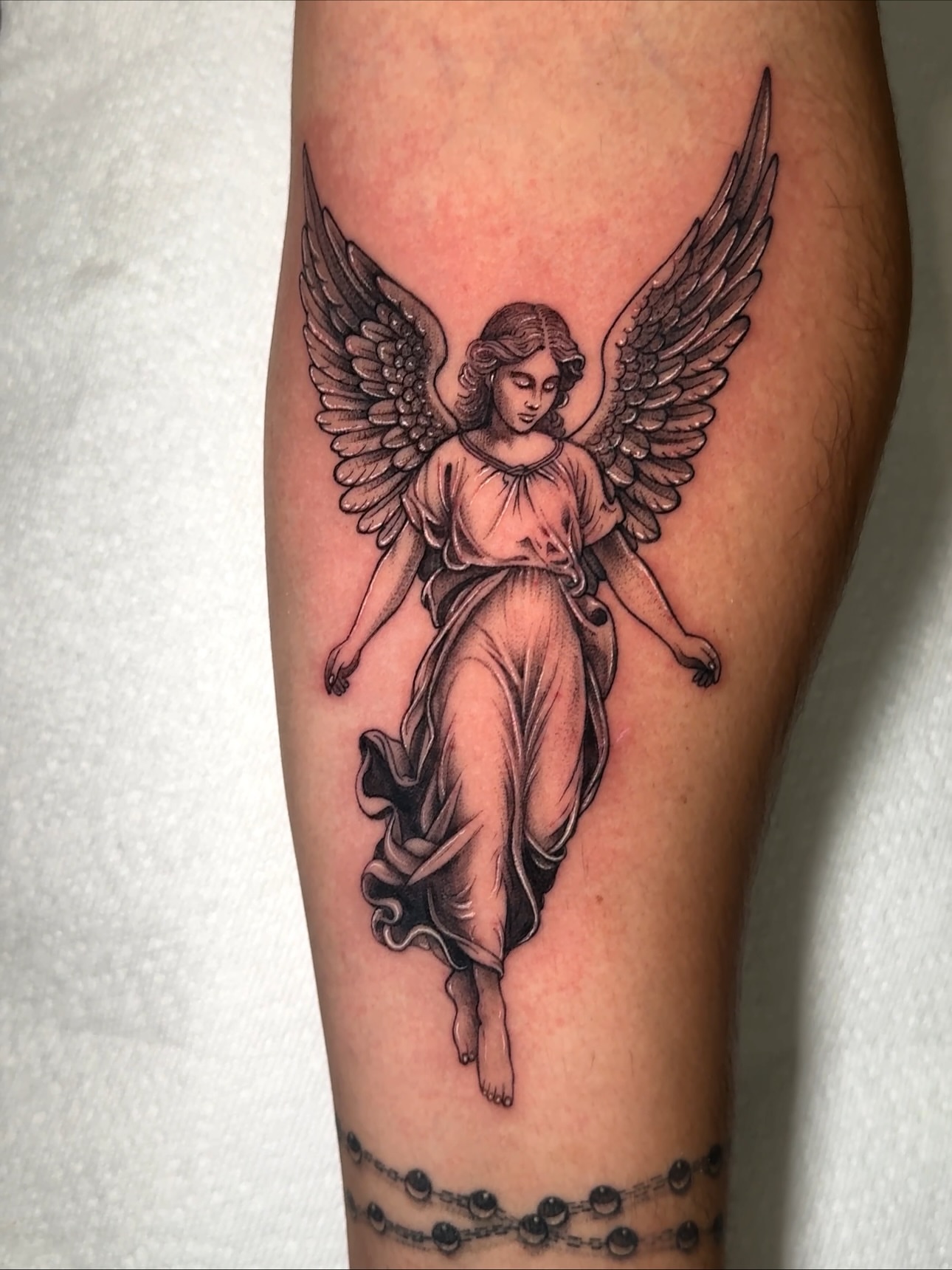 Angel realism tattoo on the forearm by Eyekonic Ink