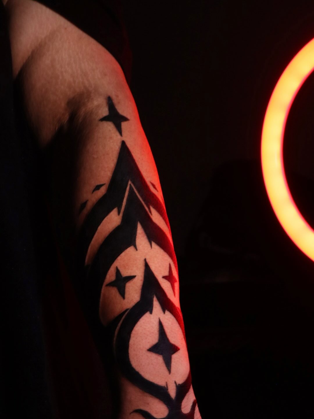 Stars and abstract shapes geometric tattoo on the forearm by Mr Letters🗡️