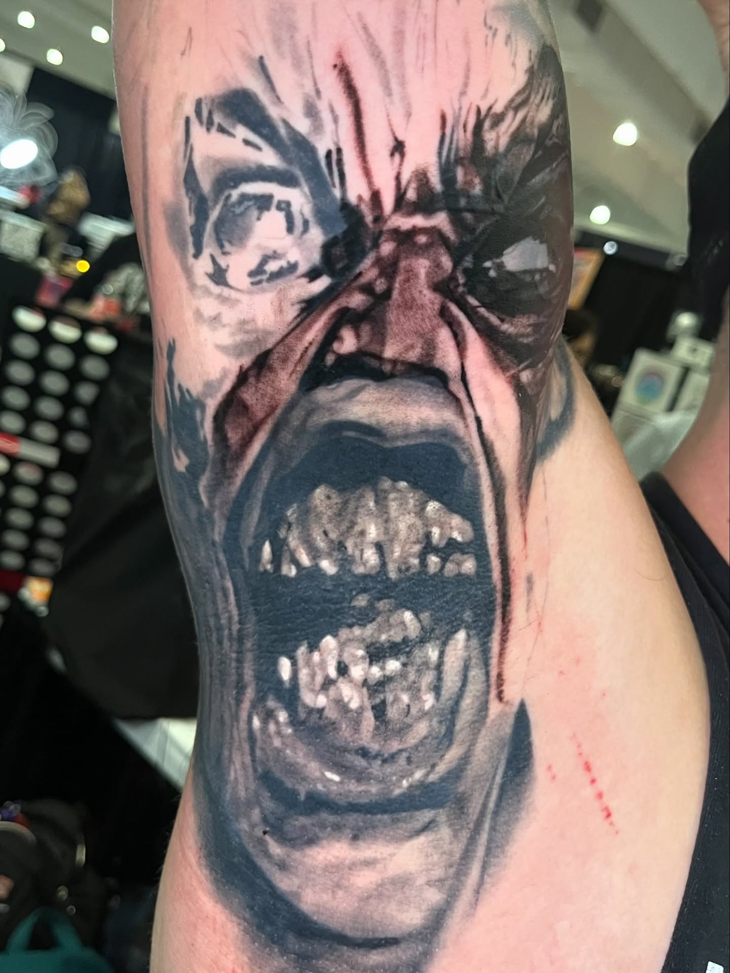 Horror creature dark realism tattoo on the forearm by Brennan Freemantle