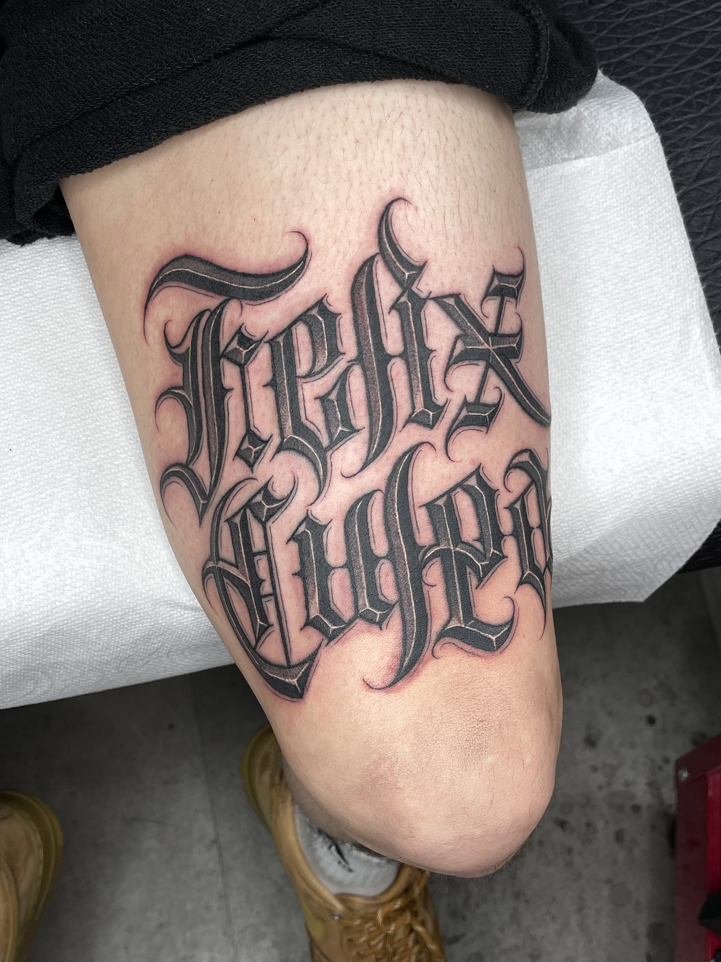 Felix Kruger tattoo on the thigh by Joon 치카노레터링