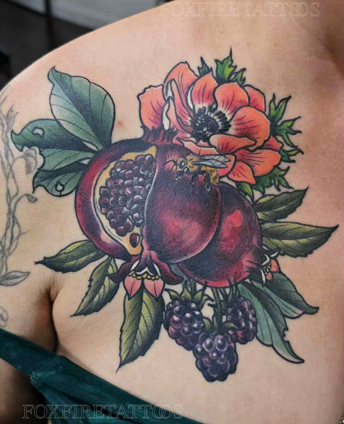 Pomegranate and flowers American traditional tattoo on the shoulder by Lindsey Chevalier - KCMO TATTOO ARTIST