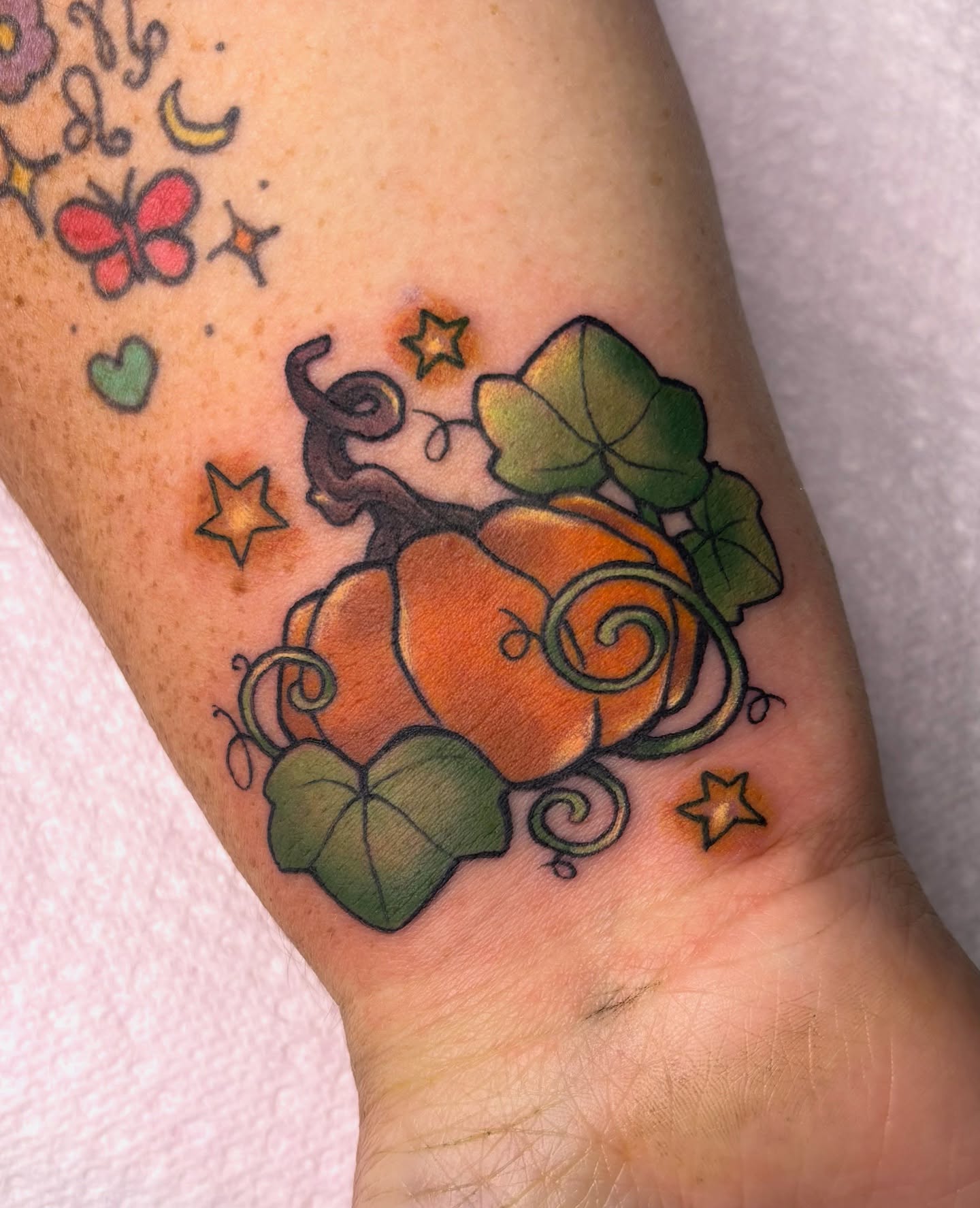 Pumpkin new school tattoo on the forearm by Lilac Rose