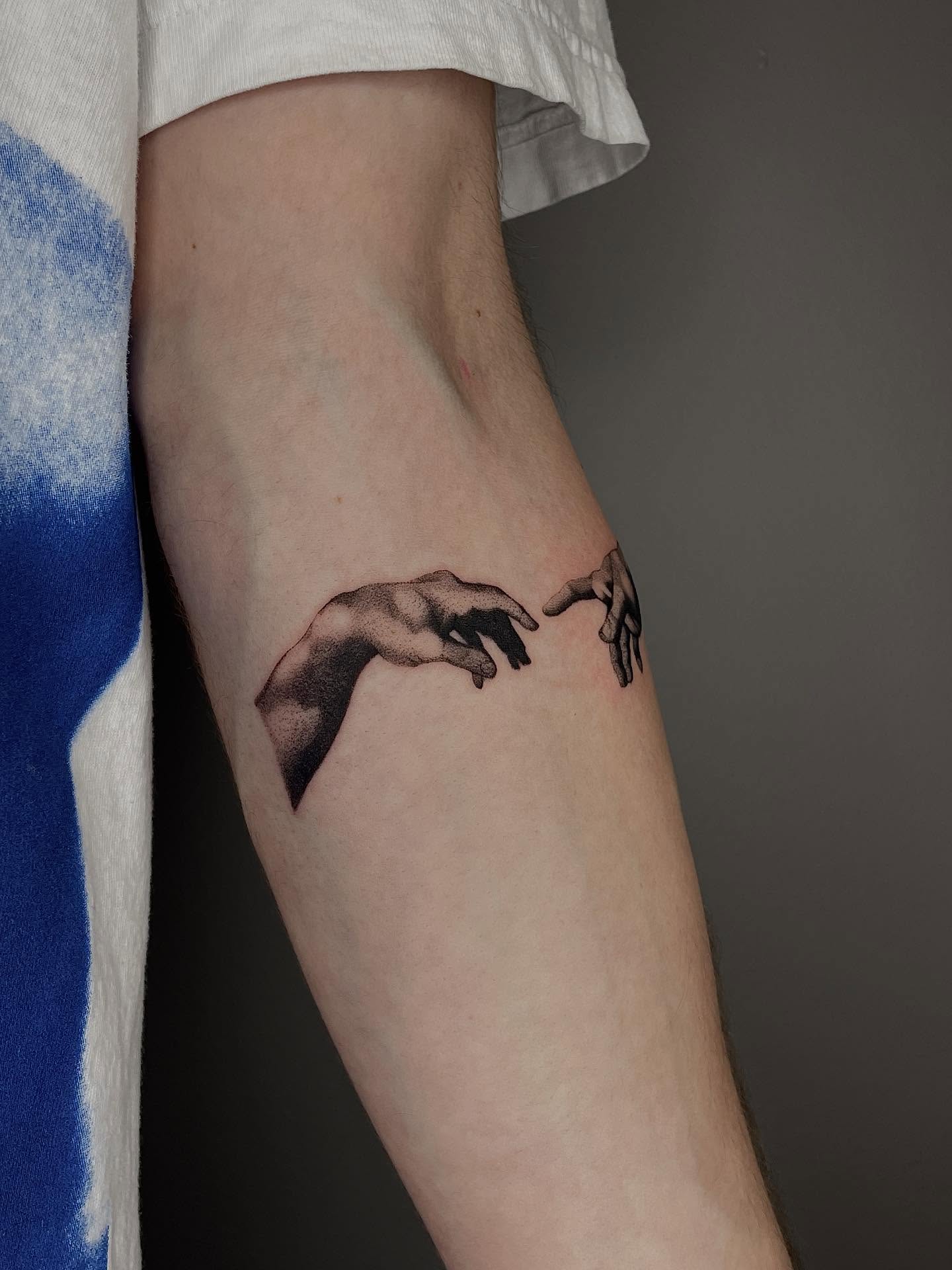 Creation realism tattoo on the forearm by Thiên Hồ